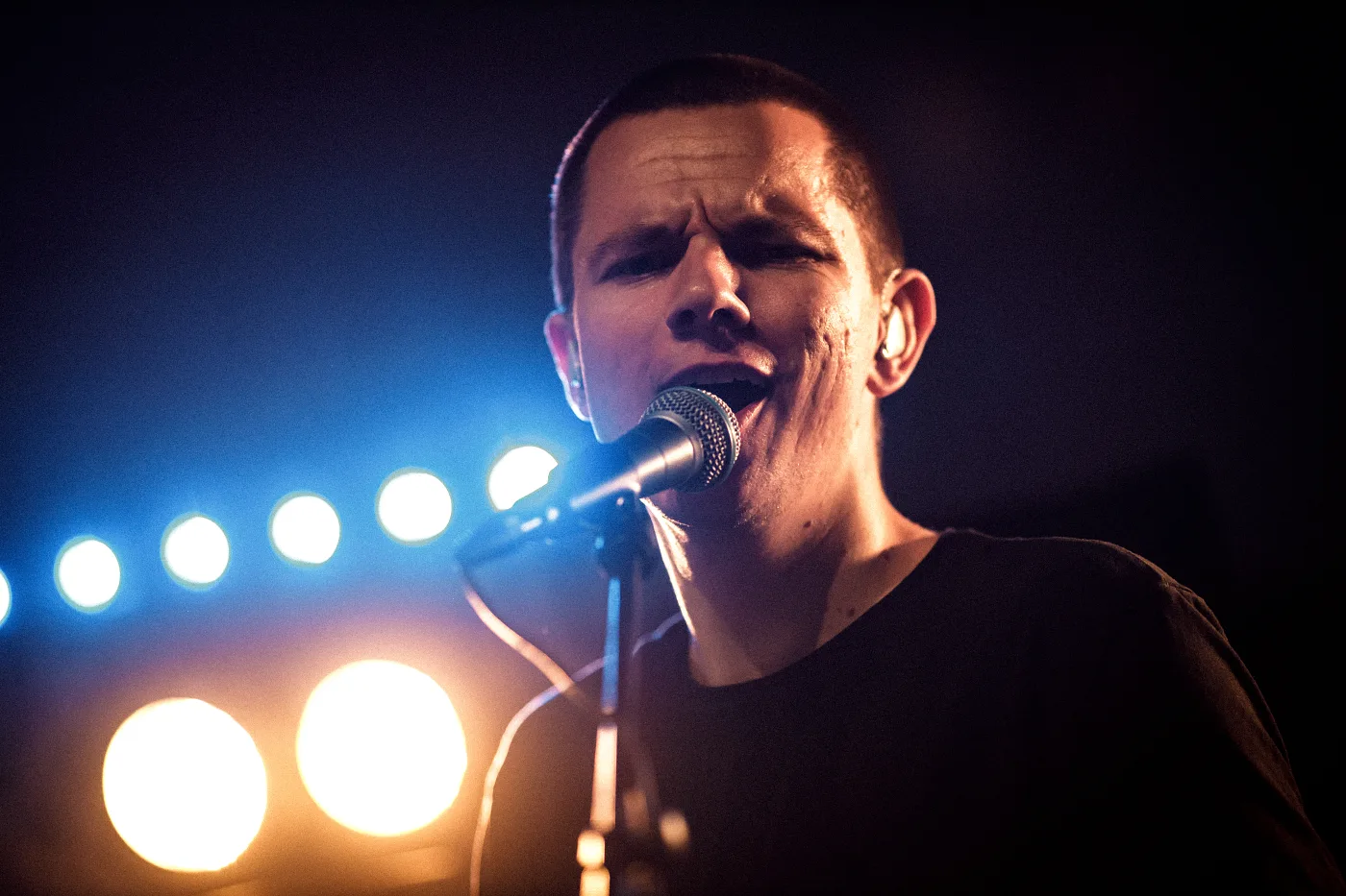 The rock band’s singer at the microphone on stage at Lindholmen Street Food Market, Gothenburg