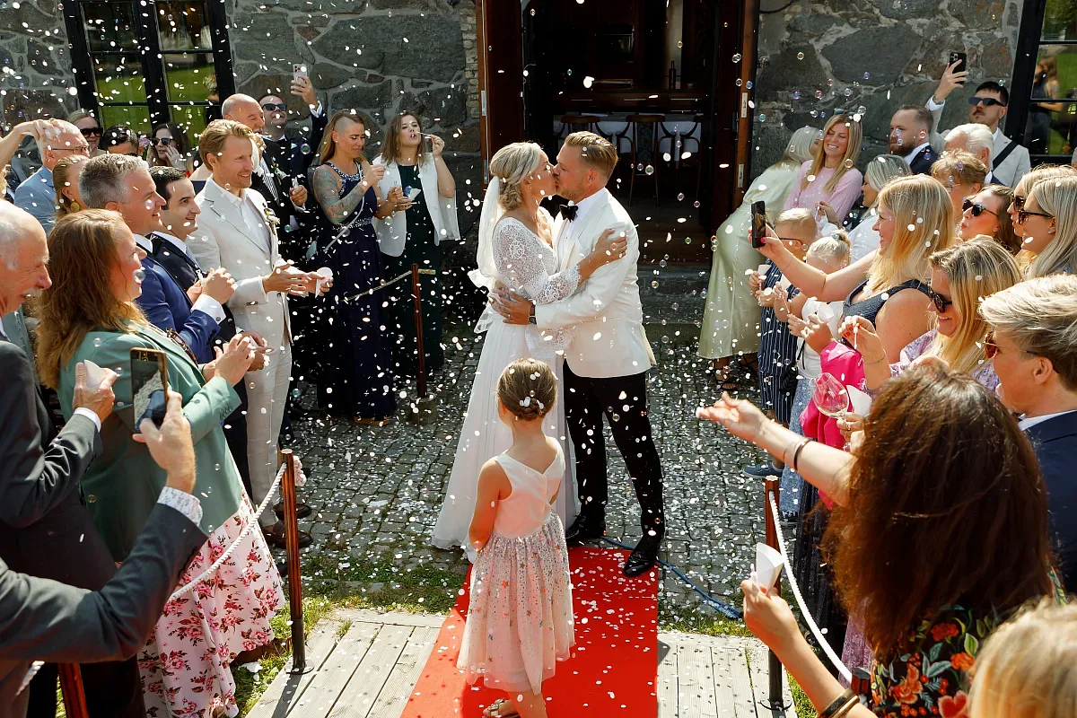 Guests congratulating the couple after the ceremony