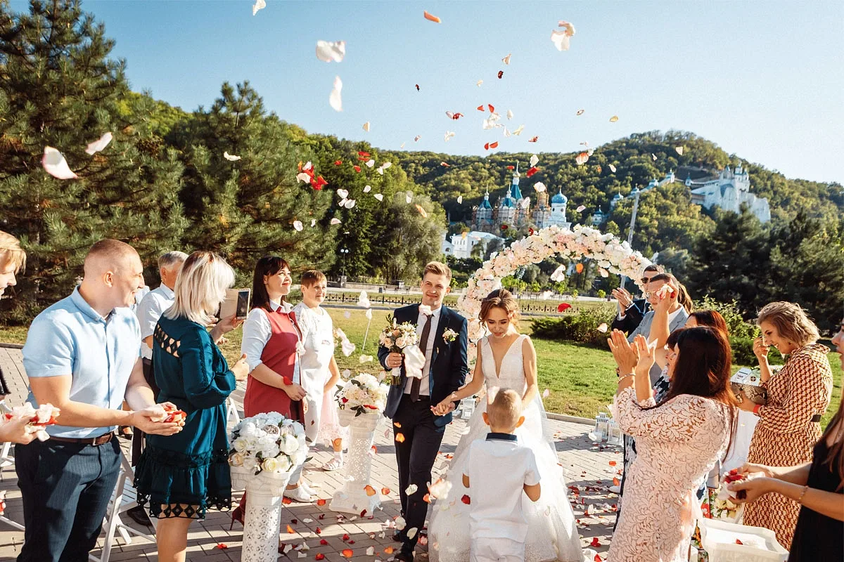Guests at an outdoor wedding ceremony