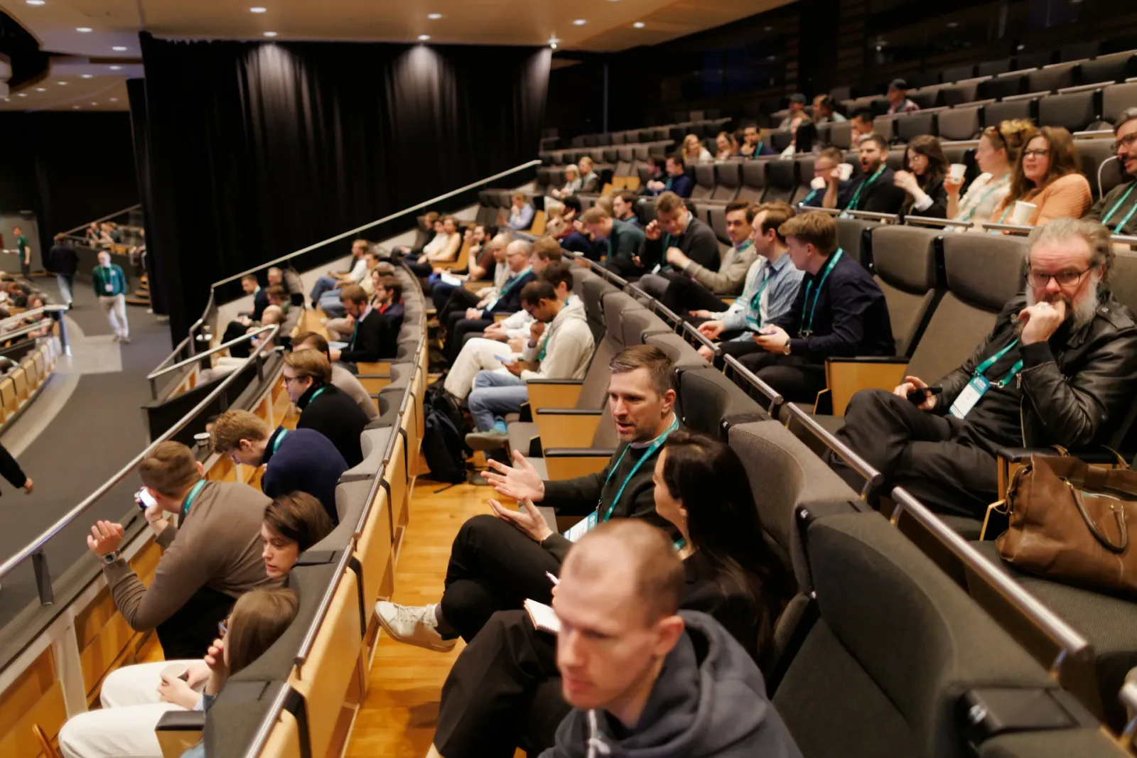 Audience in the tiered seating of a conference hall