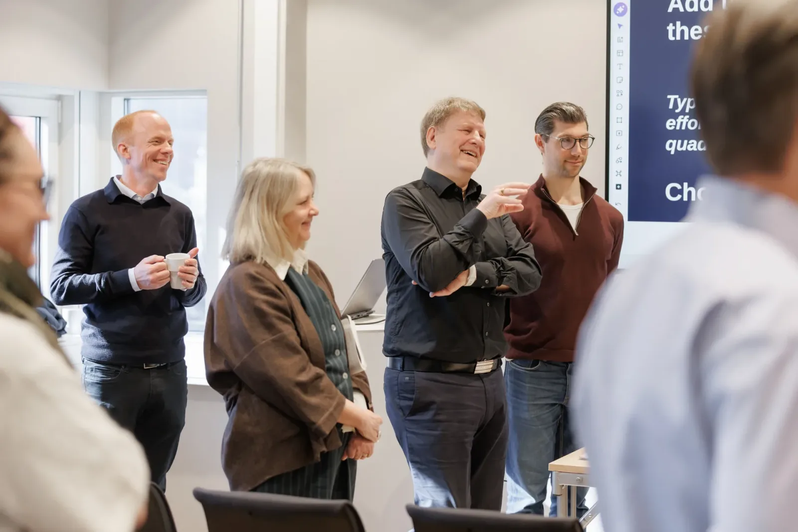 Workshop participants laughing during a discussion