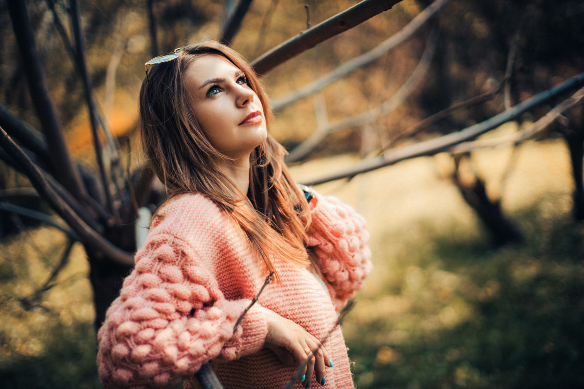 Professional family portrait taken in a well-lit studio, emphasizing emotions and family bonds