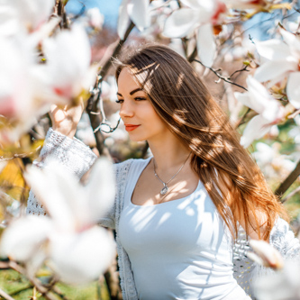Studio headshot photography with a clean background and sharp focus on the subject’s facial features