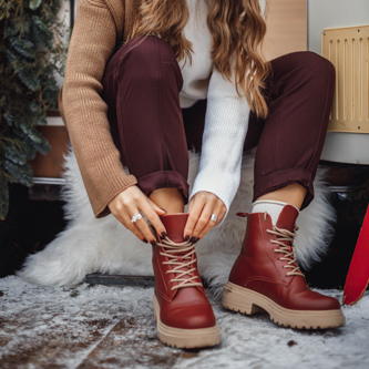 Candid family photo shoot in a comfortable studio setup, focusing on authentic moments and smiles