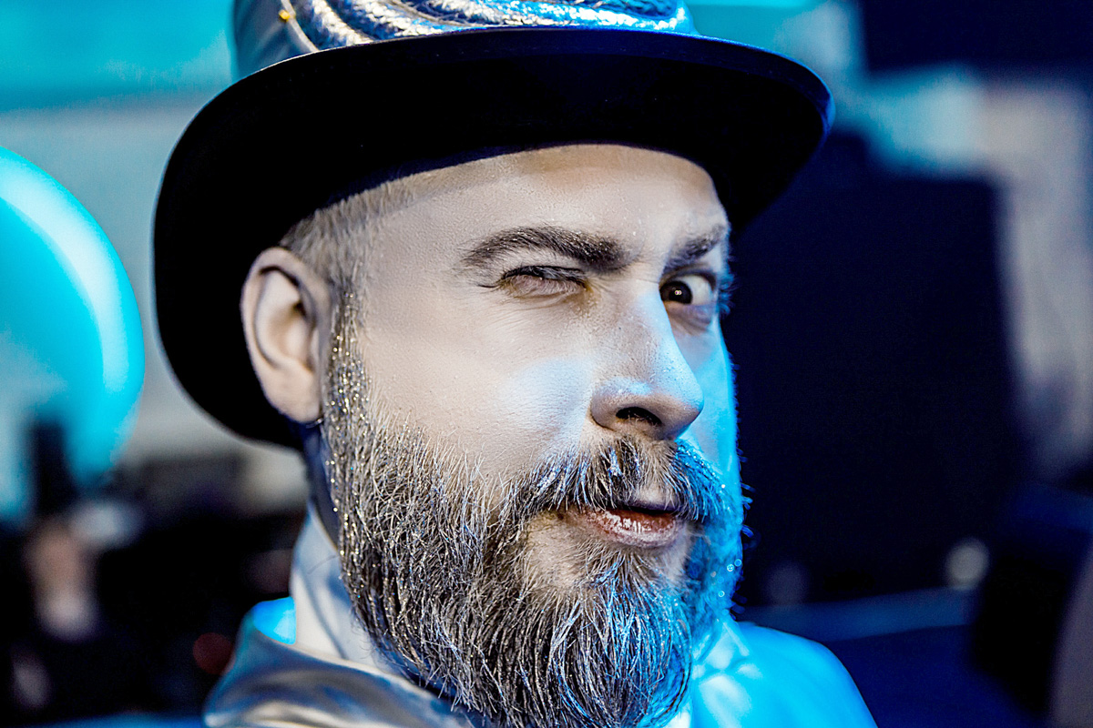 Conference photographer capturing guests at a business event using flash in a modern corporate setting