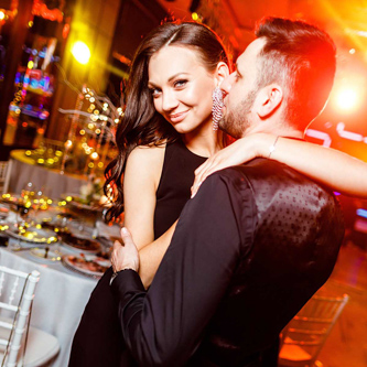 Corporate conference panel with attendees listening to keynotes and experts in a bright seminar room