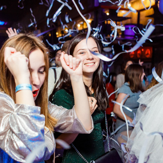 Corporate seminar with experts and industry leaders sharing insights on stage, captured under bright event lighting