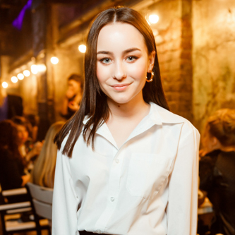 Guests networking in a professional corporate seminar, with moments captured using flash photography for better detail