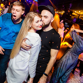 Event photographer capturing candid moments during a professional seminar with the use of flash for clear details