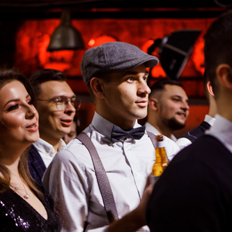 Event participants taking part in discussions during a business seminar, captured with flash photography